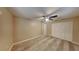 This bedroom features neutral walls, a ceiling fan, and a closet with white doors at 699 Sullivan St, Deltona, FL 32725
