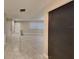 Welcoming entryway showcasing tile flooring, neutral paint, ample natural light, and access to other parts of the home at 699 Sullivan St, Deltona, FL 32725