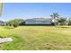 Expansive backyard with lush lawn, mature trees, and ample space for outdoor activities at 1035 Stoney Creek Dr, Lakeland, FL 33811