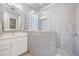 Elegant bathroom featuring a spacious walk-in shower with glass block and a stylish vanity at 1035 Stoney Creek Dr, Lakeland, FL 33811