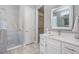 Modern bathroom showcasing a glass-enclosed shower, stylish vanity, and neutral color palette at 1035 Stoney Creek Dr, Lakeland, FL 33811