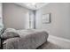 A comfortable bedroom with plush gray carpet, neutral paint, and natural light at 1035 Stoney Creek Dr, Lakeland, FL 33811