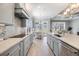 Spacious kitchen with stainless appliances, stone countertops, and eat-in area overlooking the back at 1035 Stoney Creek Dr, Lakeland, FL 33811