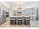 Modern kitchen featuring stainless steel appliances, a center island, and ample cabinet space at 1035 Stoney Creek Dr, Lakeland, FL 33811