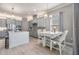 Stylish kitchen with stainless steel appliances, grey cabinetry, island with seating, and pendant lighting at 1035 Stoney Creek Dr, Lakeland, FL 33811