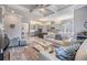 Open concept living space connects to kitchen and offers neutral decor, tray ceiling and natural light at 1035 Stoney Creek Dr, Lakeland, FL 33811