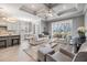 Inviting living room with coffered ceilings, neutral decor, and a large window overlooking the backyard at 1035 Stoney Creek Dr, Lakeland, FL 33811