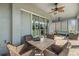 Screened lanai features comfortable seating and a dining area with views of the backyard at 1035 Stoney Creek Dr, Lakeland, FL 33811
