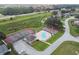 Aerial view of tennis court, playground, and pool for recreational activities at 133 Grovepark Dr, Davenport, FL 33837