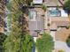 Aerial shot shows a house with a screened-in pool, shed, landscaping, and mature trees at 133 Grovepark Dr, Davenport, FL 33837