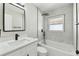 Modern bathroom featuring a shower-tub combination with tiled walls and black hardware at 133 Grovepark Dr, Davenport, FL 33837