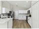 Modern kitchen featuring updated cabinets, countertops, and stainless steel appliances at 133 Grovepark Dr, Davenport, FL 33837