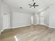 Spacious living room with updated floors and natural light from the front door window at 133 Grovepark Dr, Davenport, FL 33837