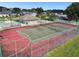 Community tennis court surrounded by fences, and a restroom with easy access at 133 Grovepark Dr, Davenport, FL 33837