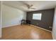 Spacious bedroom featuring hardwood floors and a ceiling fan at 4621 Queens Point Drive, Lakeland, FL 33813