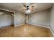 Bedroom featuring wood floors, a closet, and neutral walls at 4621 Queens Point Drive, Lakeland, FL 33813