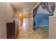 Inviting foyer with tile flooring, a hallway, and an open view to the living area at 4621 Queens Point Drive, Lakeland, FL 33813