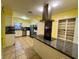 Modern kitchen with stainless steel appliances, granite countertops, and custom cabinets at 4621 Queens Point Drive, Lakeland, FL 33813