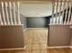 Spacious living room showcasing neutral tile floors and ample natural light at 4621 Queens Point Drive, Lakeland, FL 33813