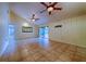 Bright living room featuring tile flooring and sliding glass doors to the outdoor space at 4621 Queens Point Drive, Lakeland, FL 33813