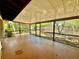 Enclosed patio featuring a screen and view of the fenced in backyard at 4621 Queens Point Drive, Lakeland, FL 33813