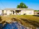Large backyard with sliding glass doors, patio area, and grassy area. Great for outdoor living at 4746 Wales St, Lake Wales, FL 33859