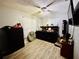 Comfortable bedroom with hardwood floors and ceiling fan at 4746 Wales St, Lake Wales, FL 33859