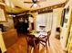 Eat-in kitchen area with wood floors, wooden table and chairs at 4746 Wales St, Lake Wales, FL 33859