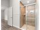 Spa-like tiled shower with glass door, and towel rack at 12164 Se 85Th Ct, Belleview, FL 34420