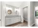 Bathroom featuring double vanity, granite countertops, and toilet room at 12164 Se 85Th Ct, Belleview, FL 34420