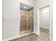 Spa-like tiled shower with glass door and walk-in closet at 12164 Se 85Th Ct, Belleview, FL 34420