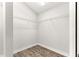 Walk-in closet with laminate flooring and wire shelving at 12164 Se 85Th Ct, Belleview, FL 34420