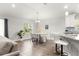 Bright dining area featuring a chandelier, and gray upholstered chairs at 12164 Se 85Th Ct, Belleview, FL 34420