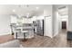 Open kitchen with stainless steel appliances, granite countertops, and a breakfast bar at 12164 Se 85Th Ct, Belleview, FL 34420