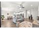 Bright, open-concept living area with modern furnishings and a seamless flow to the kitchen and dining spaces at 12164 Se 85Th Ct, Belleview, FL 34420
