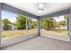 Spacious screened porch overlooking the grassy backyard, great for outdoor entertaining at 12164 Se 85Th Ct, Belleview, FL 34420