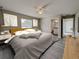 Calming bedroom with a large window, ceiling fan, and ensuite bathroom for privacy at 332 W 8Th St, Lakeland, FL 33805