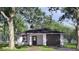 Charming single-story home featuring a brick walkway, attached garage, and inviting front door at 332 W 8Th St, Lakeland, FL 33805