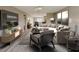 Open-concept living room with lots of seating and decorative furnishings offers modern style at 332 W 8Th St, Lakeland, FL 33805