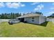 Picture of the backyard with a well-kept lawn and above-ground pool at 5419 Knights Landing Dr, Lakeland, FL 33810