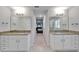Bathroom featuring granite countertops, dual sinks, and stylish vanity at 5419 Knights Landing Dr, Lakeland, FL 33810