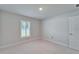 Empty bedroom with a bright window and white trim at 5419 Knights Landing Dr, Lakeland, FL 33810