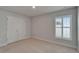 Bedroom with window and closet doors and bright natural light at 5419 Knights Landing Dr, Lakeland, FL 33810