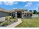 Charming home featuring a well-manicured lawn and beautifully landscaped front yard at 5419 Knights Landing Dr, Lakeland, FL 33810