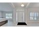 Bright and spacious foyer featuring a white front door with sidelights and transom window at 5419 Knights Landing Dr, Lakeland, FL 33810