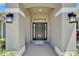 Inviting front entrance with a stylish door, elegant sconces, and welcoming decor at 5419 Knights Landing Dr, Lakeland, FL 33810