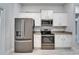 Modern kitchen with stainless steel appliances and white cabinetry at 5419 Knights Landing Dr, Lakeland, FL 33810