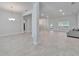 Open concept living area featuring tile flooring and natural light at 5419 Knights Landing Dr, Lakeland, FL 33810