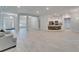 Open living area with modern kitchen, tile flooring, and ample natural light at 5419 Knights Landing Dr, Lakeland, FL 33810