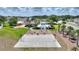 Full basketball court is surrounded by green spaces and includes benches and access to additional play areas at 634 Canna Dr, Davenport, FL 33897